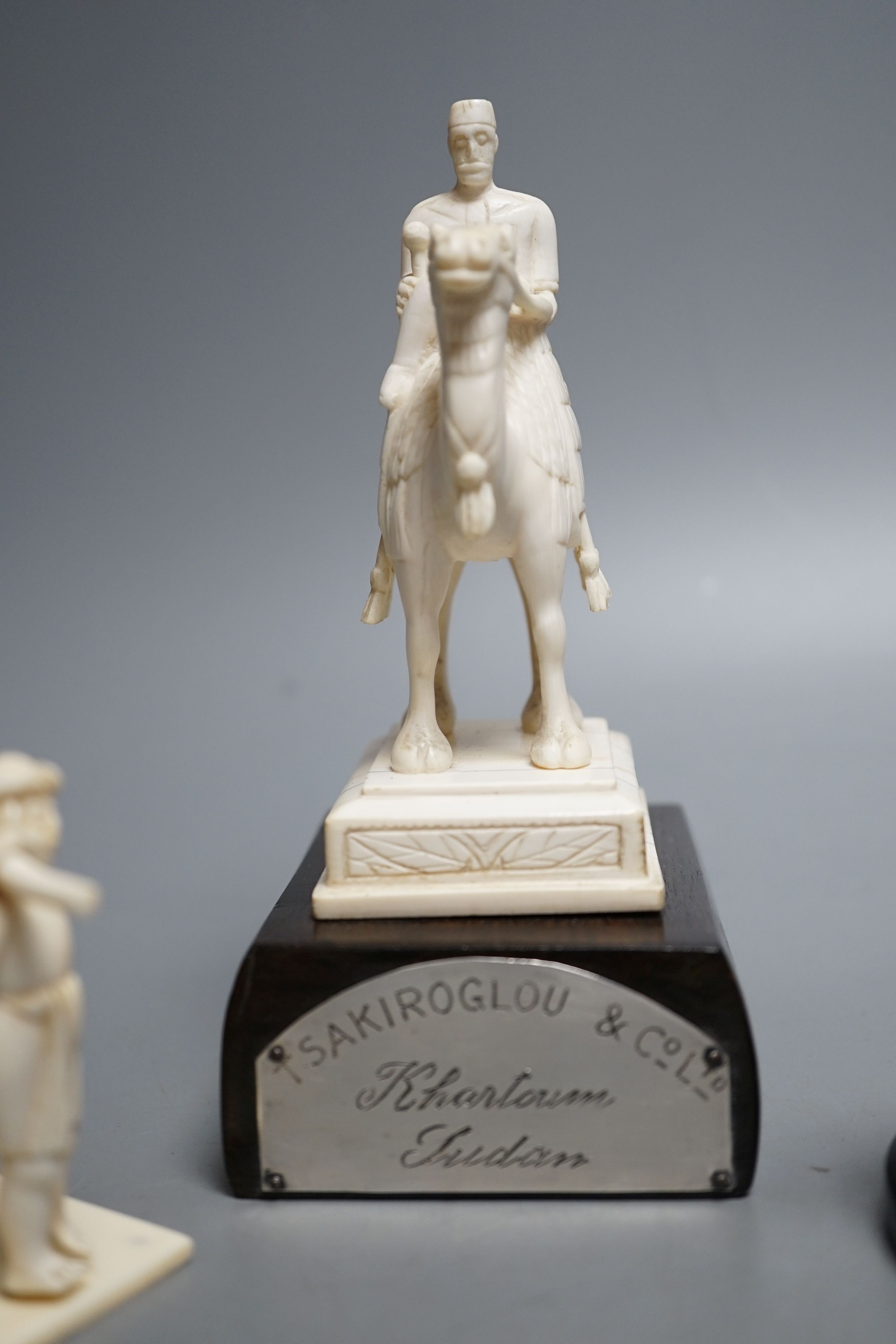 An Indian ivory sedan chair, an ivory horse and an ivory man on camel (General Gordon) with white metal plaque, 19th/early 20th century , Ivory carving of a man on a camel 14.5cms high.